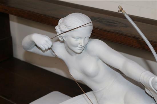 An Art Deco-style figurine of a lady and a dog, signed S. Melani